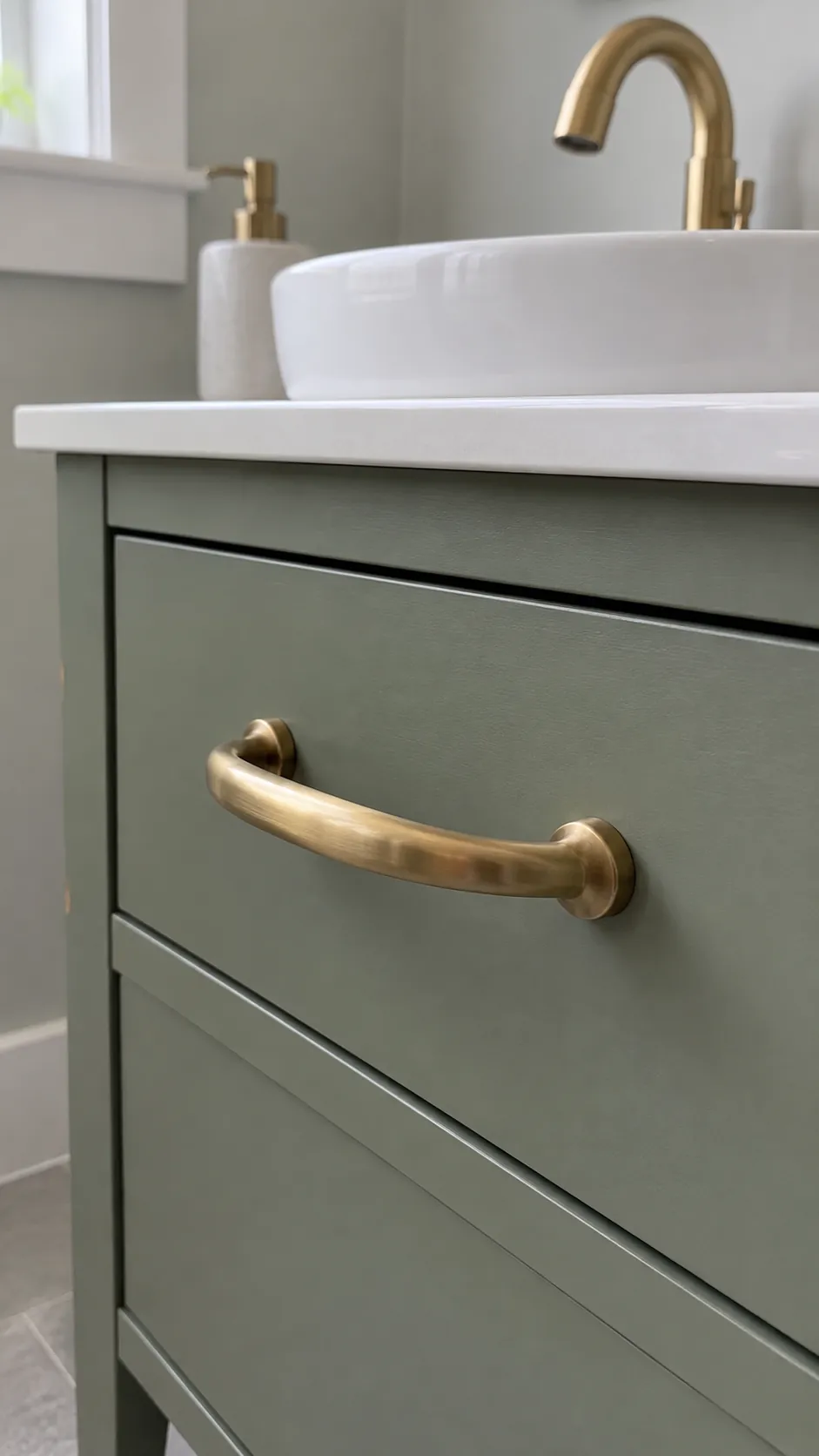 Rounded cabinet pulls echo a curved faucet in an existing powder room