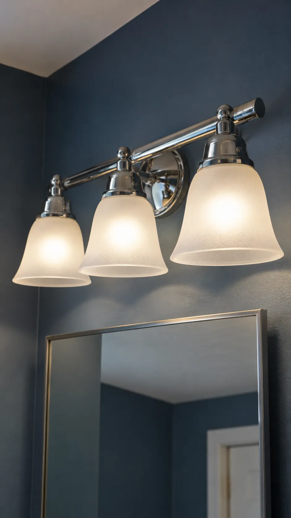 Matching bulb color in a modest three light fixture in an existing powder room