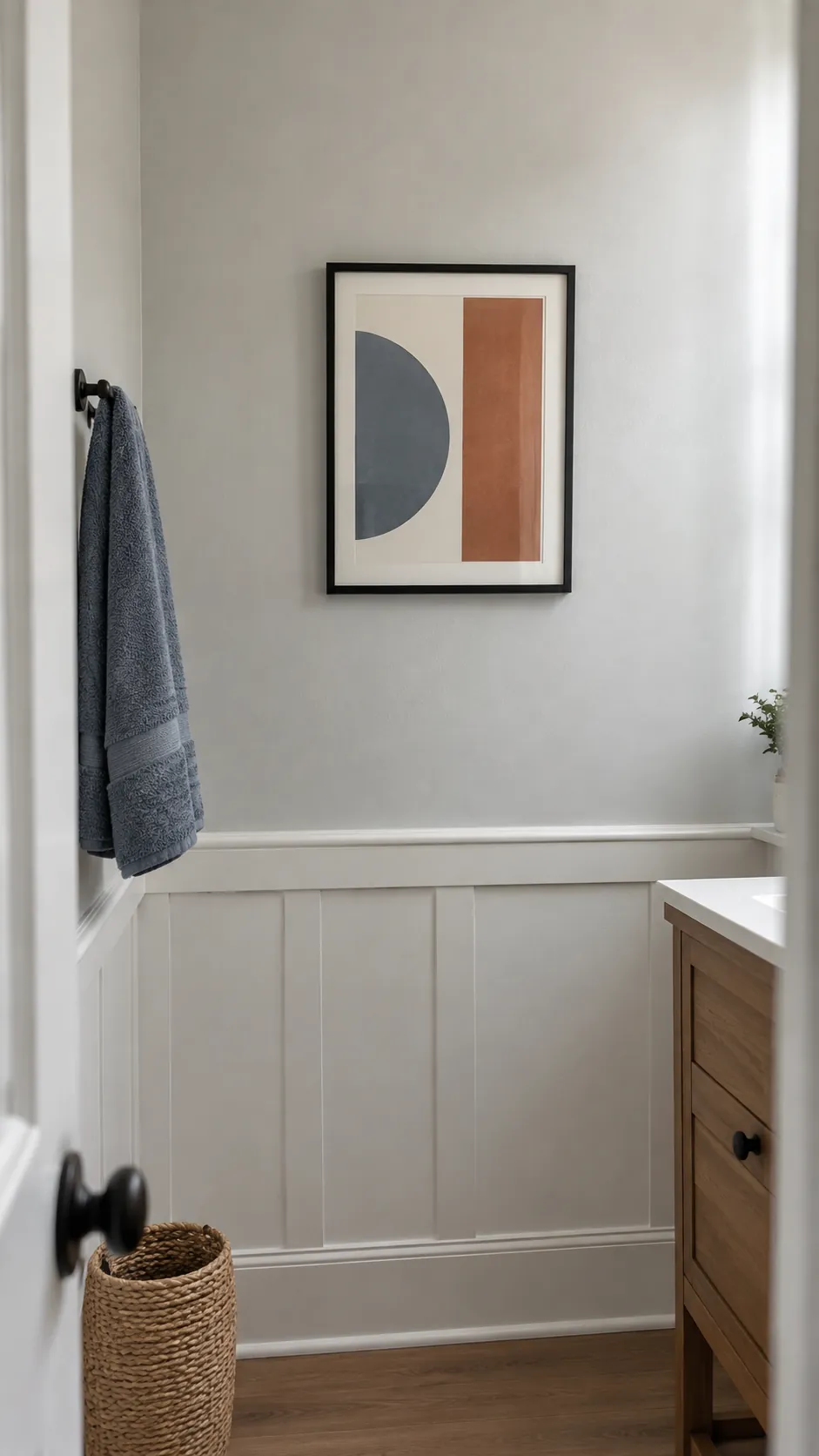 Geometric print repeats blue and rust accents in an existing powder room