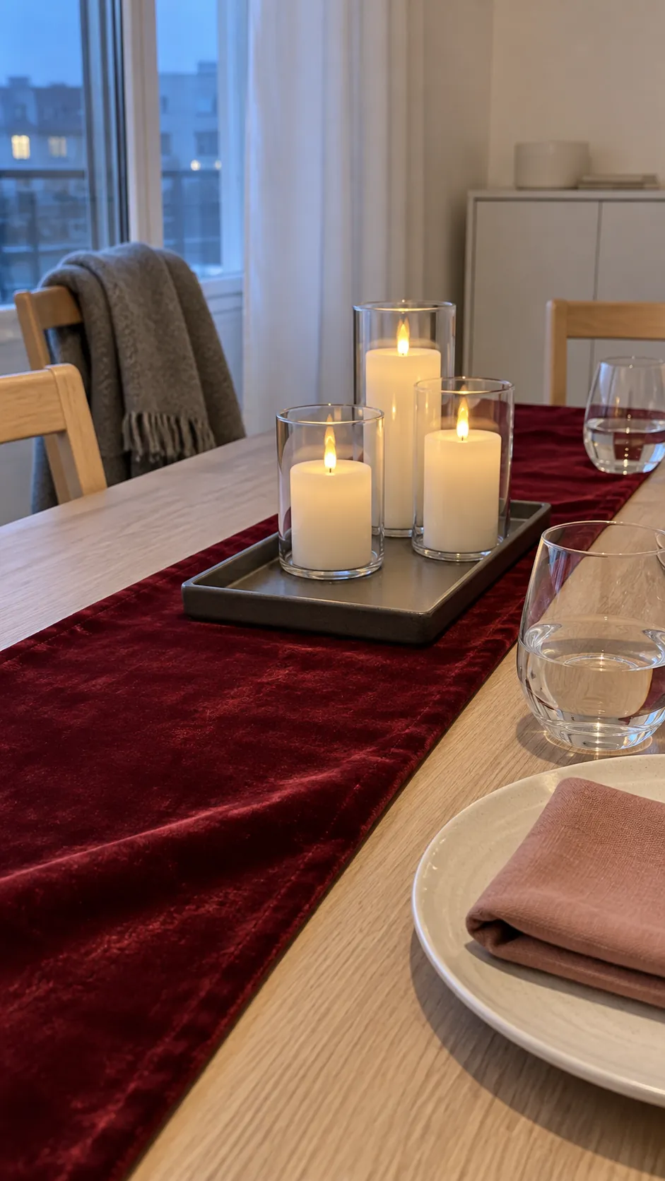 Burgundy velvet with flameless candlelight for a Christmas gathering