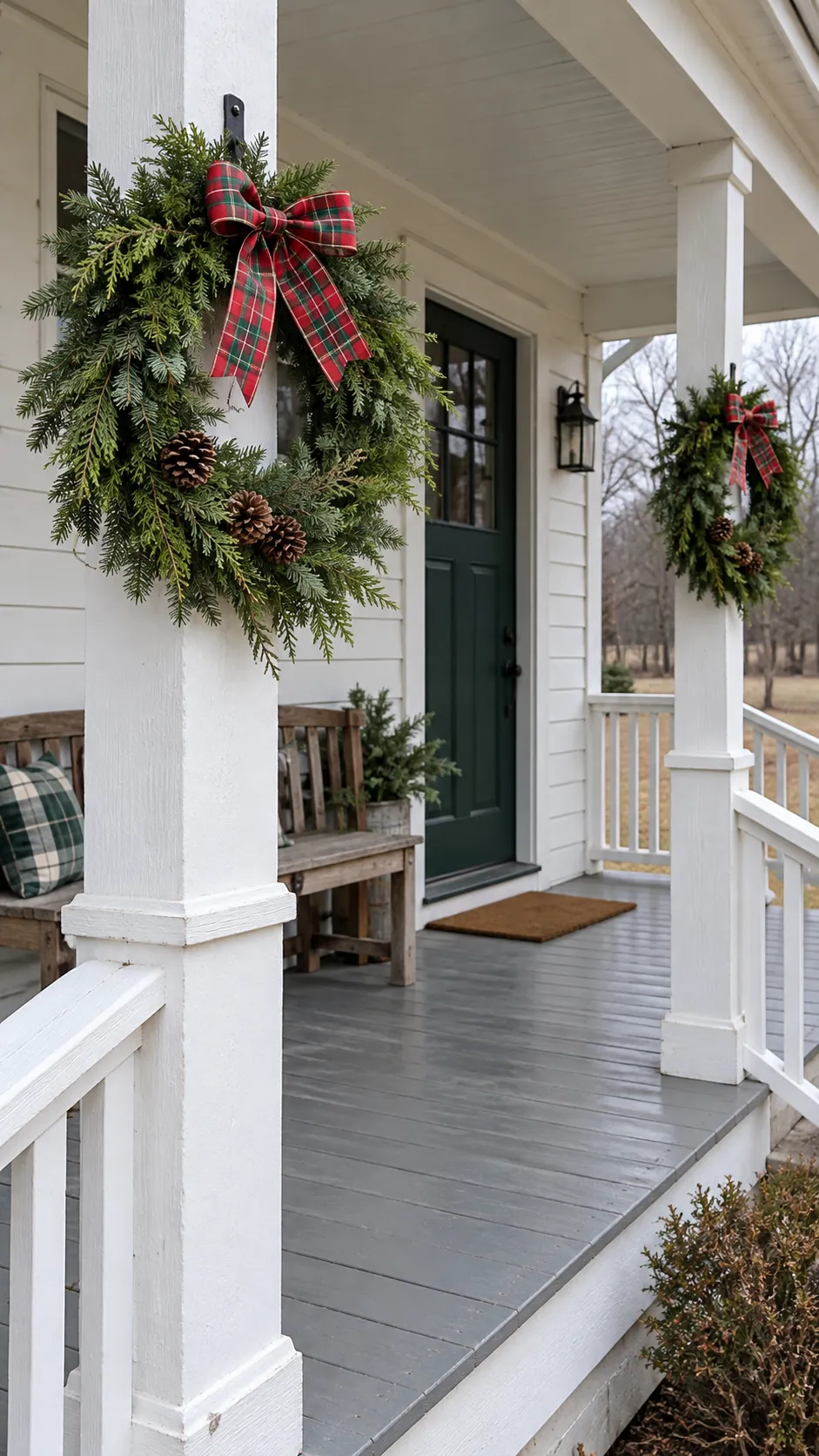 Evergreen wreaths on porch posts as a DIY outdoor Christmas decoration