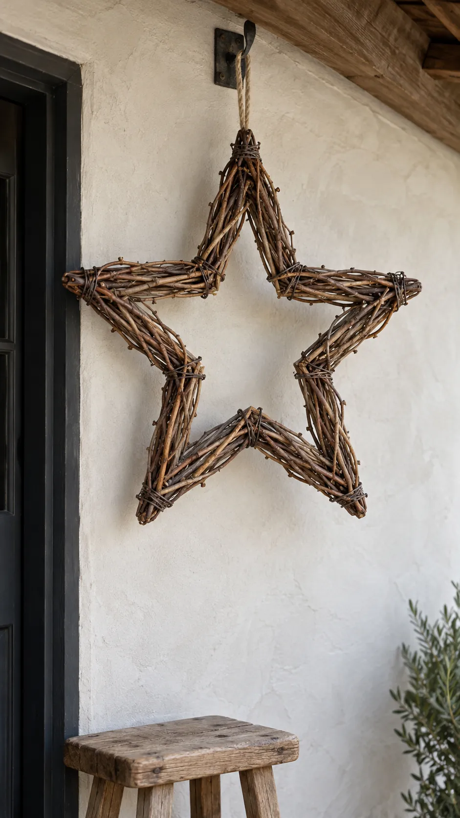 A grapevine star for a sheltered wall as a DIY outdoor Christmas decoration