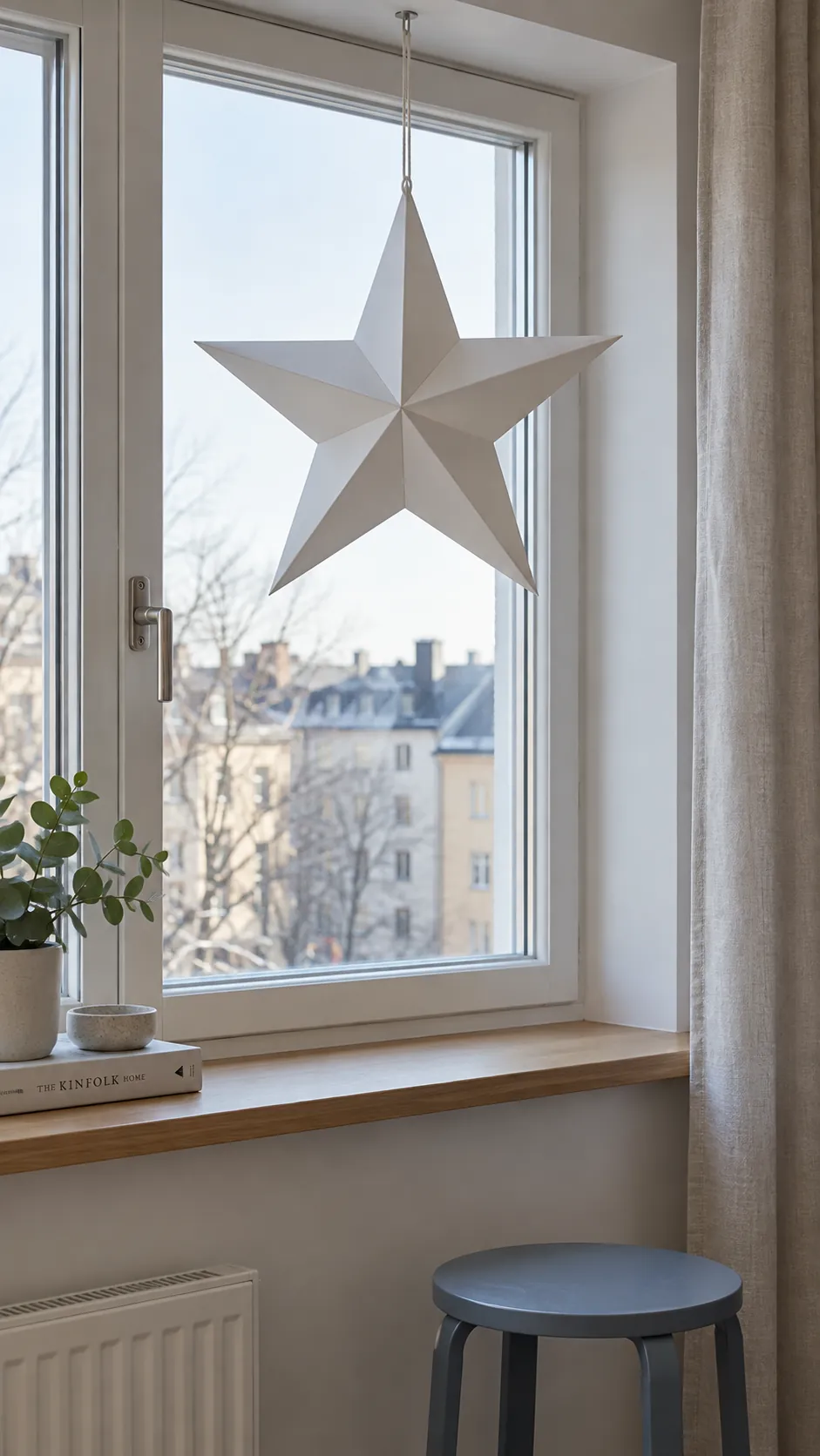 One folded paper star in the window for minimalist Christmas decor