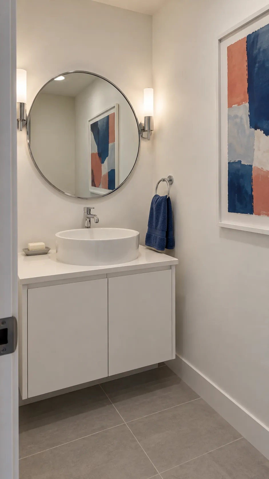 Color abstract reflected across the room paired with a round powder room mirror