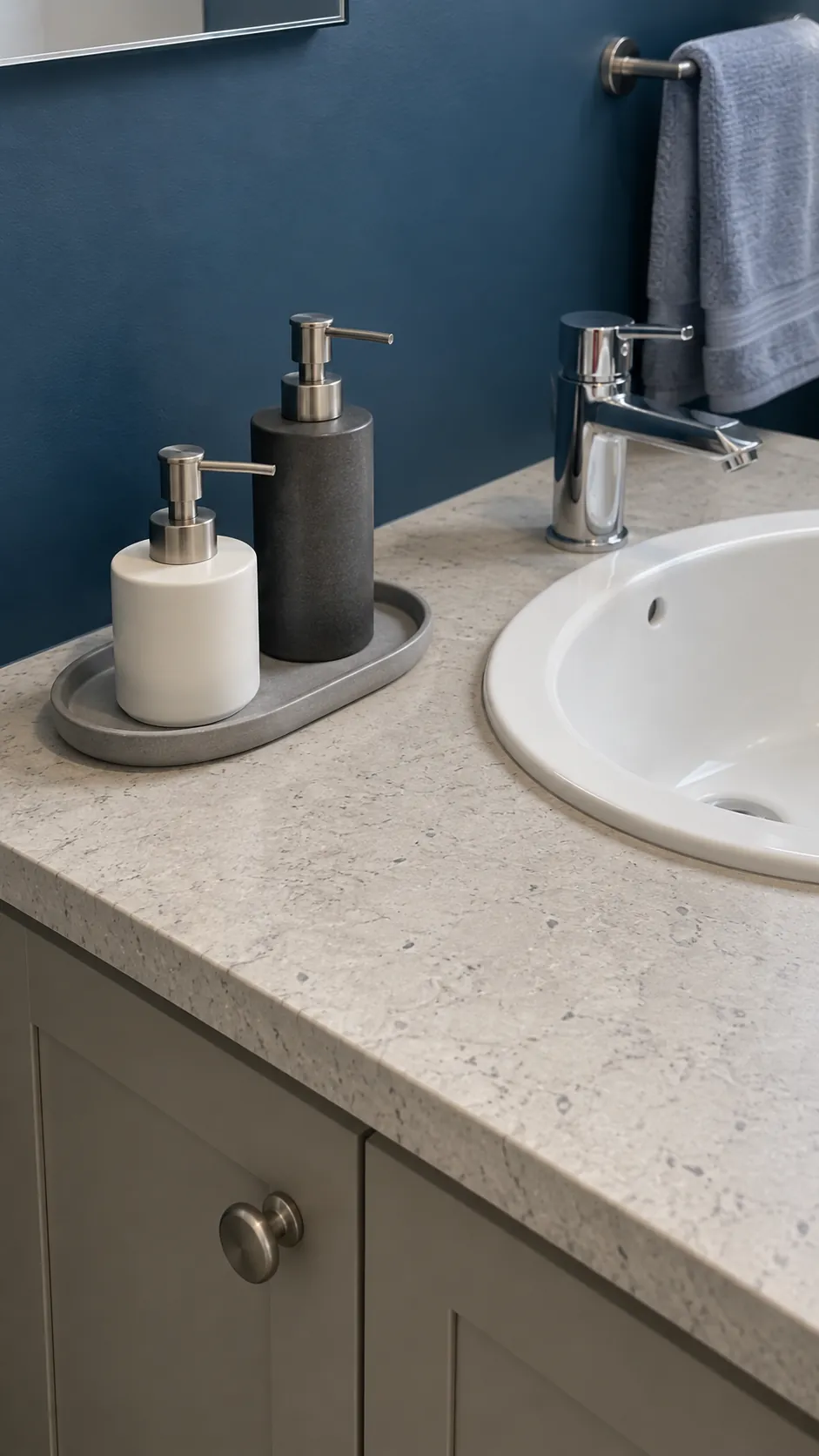 A small tray groups soap and lotion in a guest bathroom