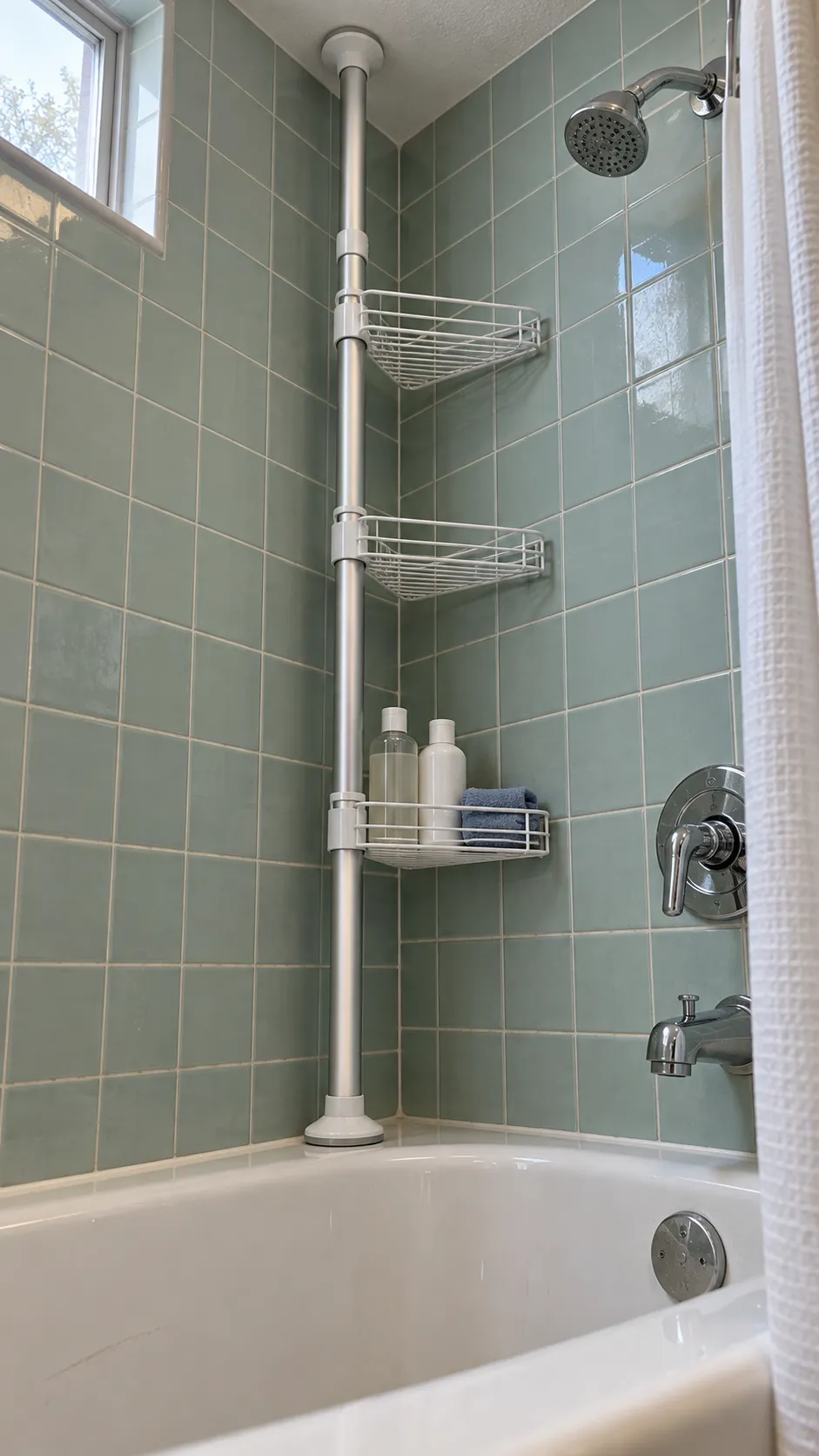 Vertical tension pole shower caddy fitted in a stable rental shower corner