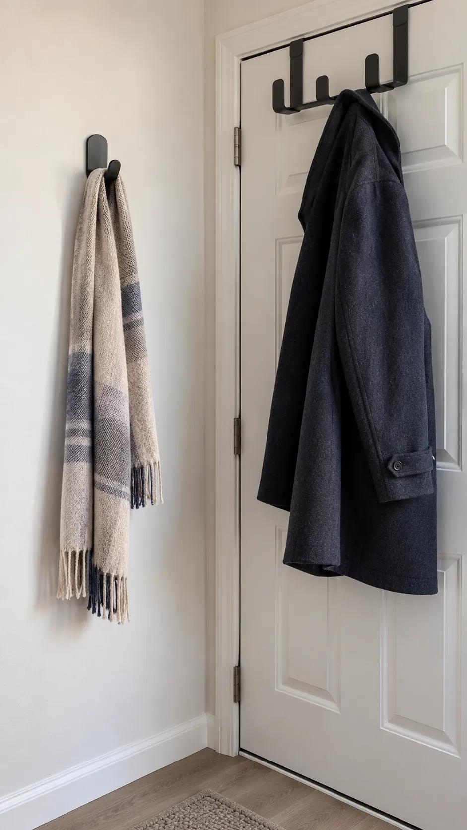 Light scarf and heavier coat arranged on separate renter hooks