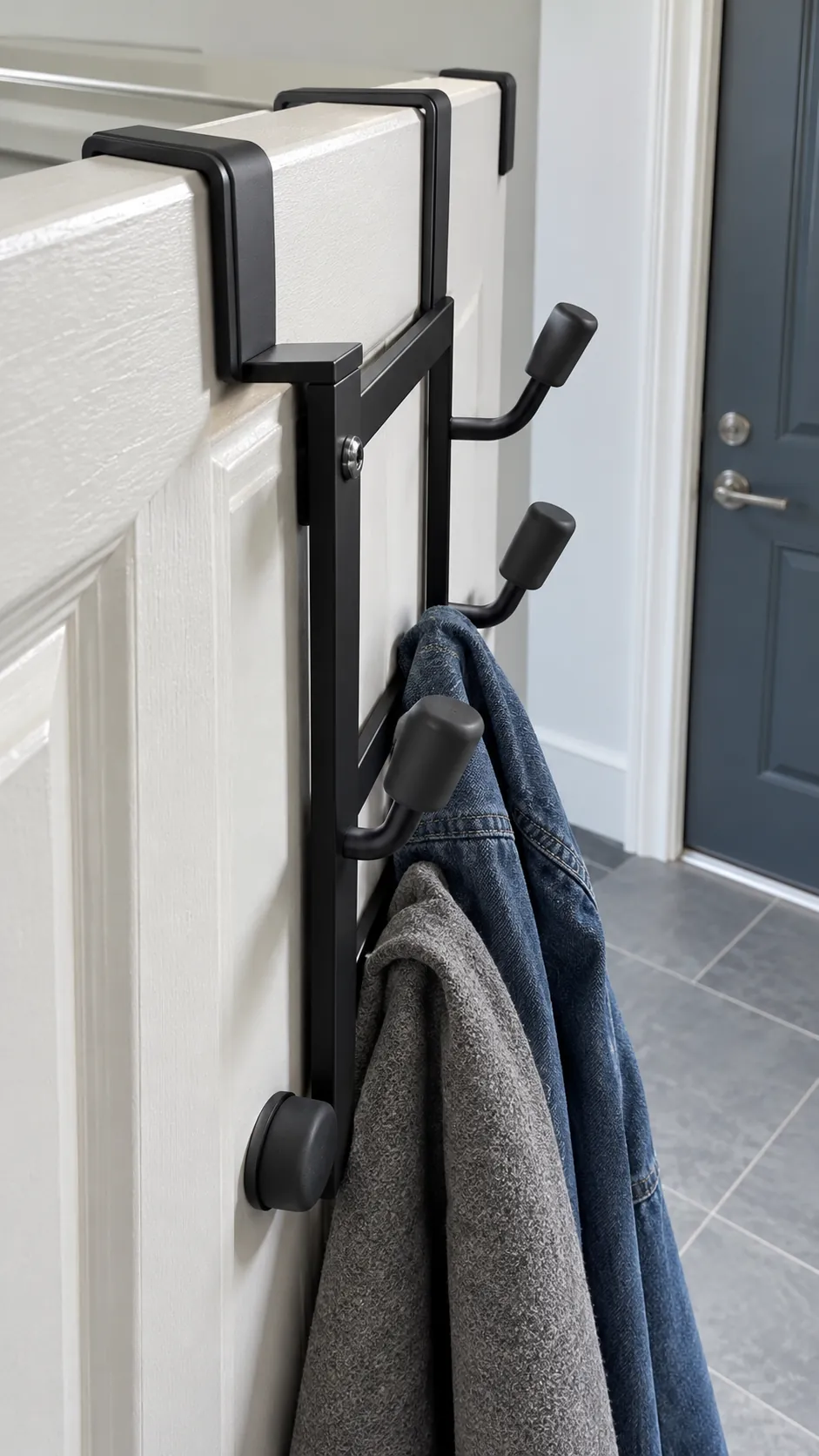 Padded over door hooks protecting a painted apartment door