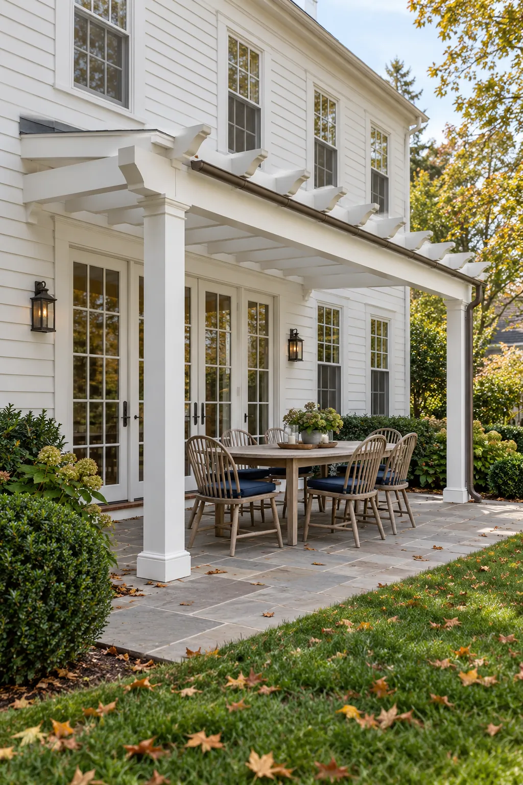 Attached classic pergola aligned with a colonial house facade