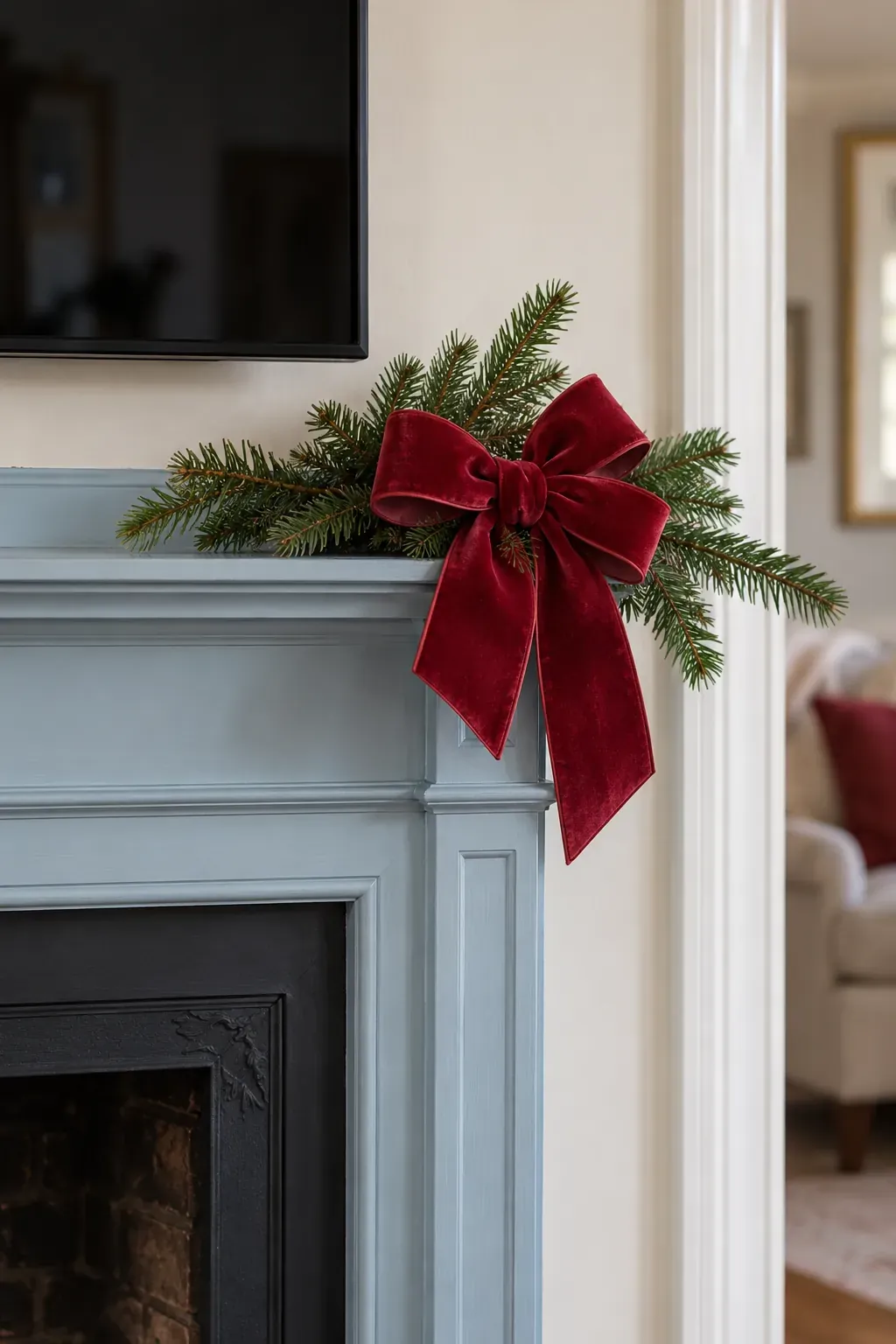Put one velvet bow at the end on a Christmas mantel with a television