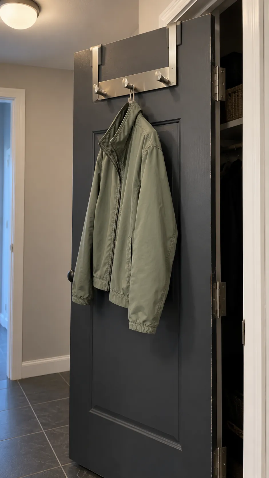 Slim rack holding one light jacket on a suitable interior closet door
