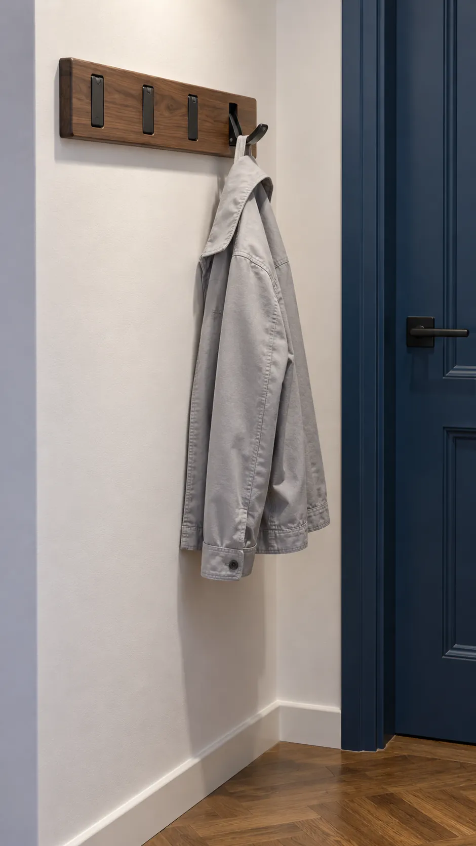 Small folding wall hooks with one light jacket and unused hooks closed