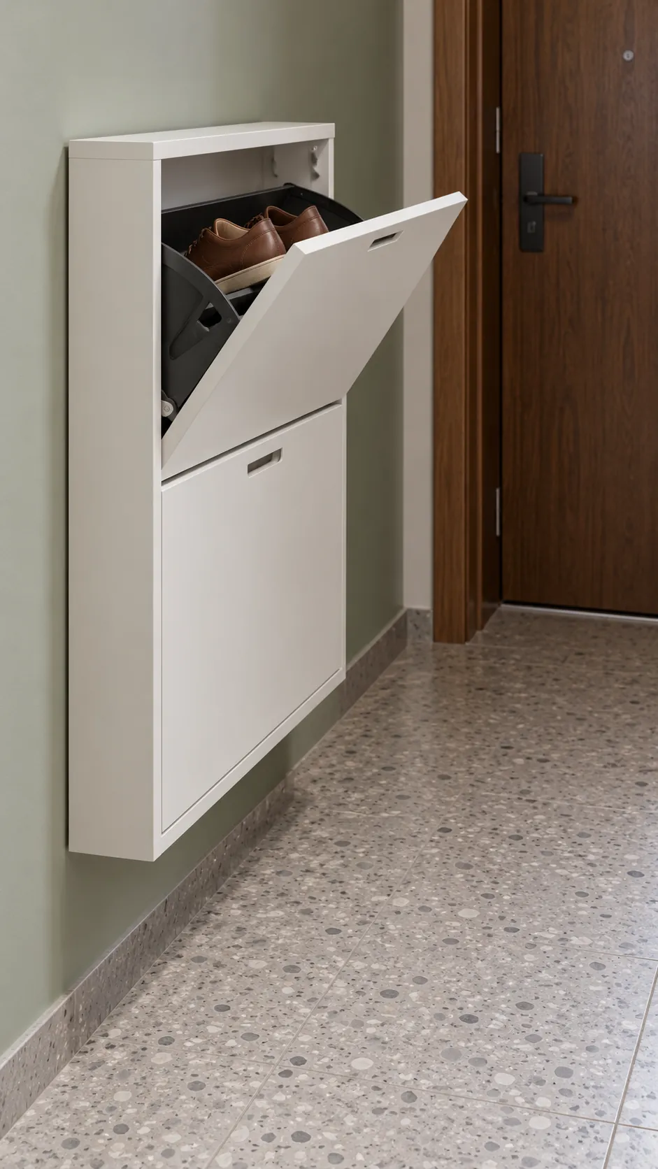 Shallow wall fixed shoe cabinet leaving the hallway floor clear