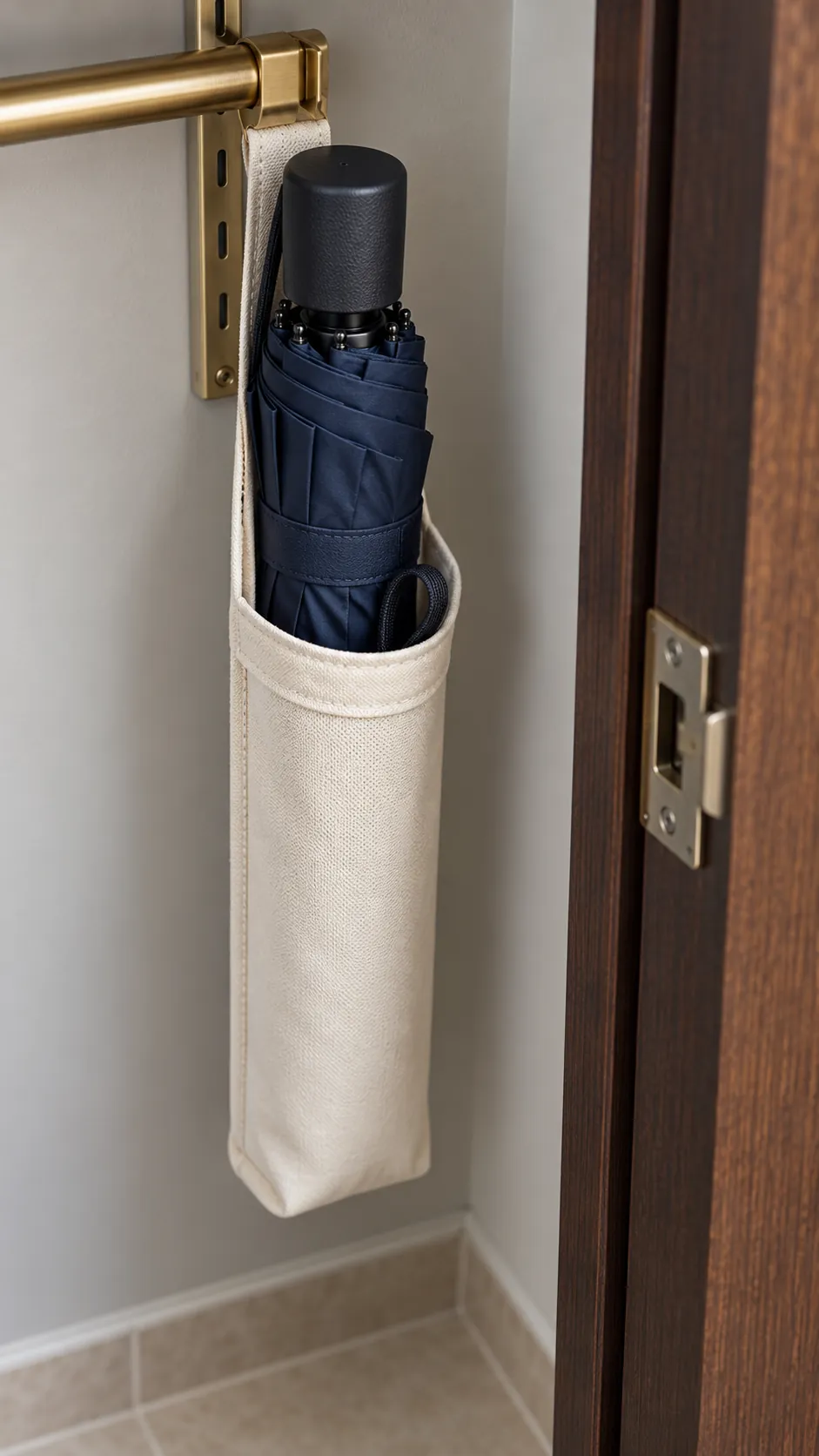Dry compact umbrella stored in a narrow sleeve inside a closet