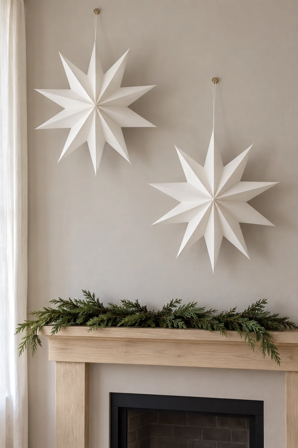 Let folded paper stars add height for white Christmas mantel decor