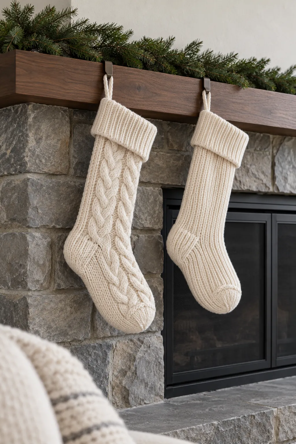 Use knitted stockings as the soft layer for white Christmas mantel decor
