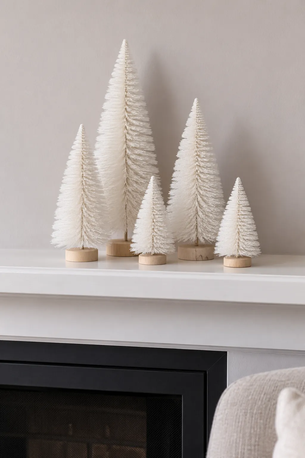 Arrange a bottlebrush forest for white Christmas mantel decor