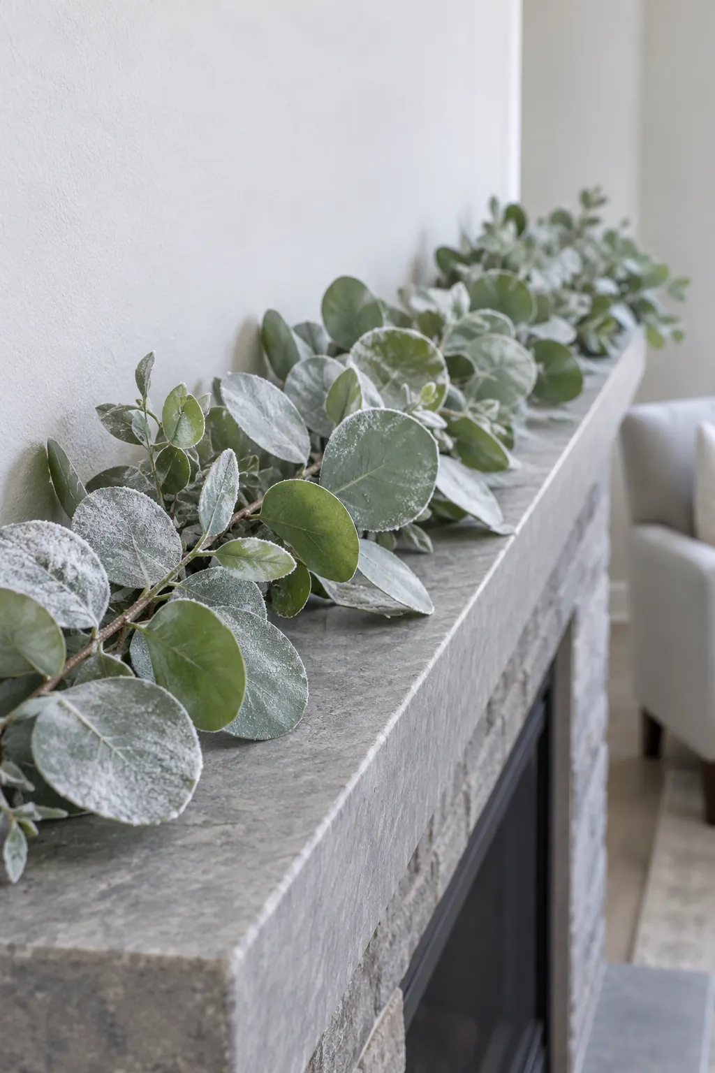 Soften the outline with frosted eucalyptus for white Christmas mantel decor
