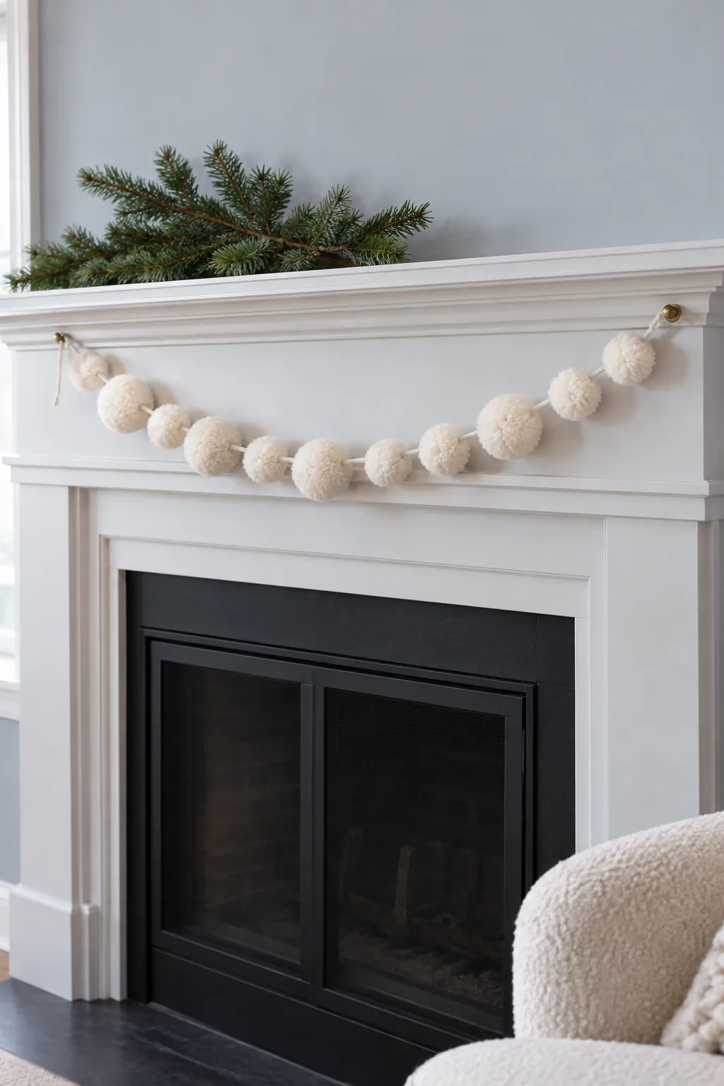 Run a soft pompom strand along the front for white Christmas mantel decor