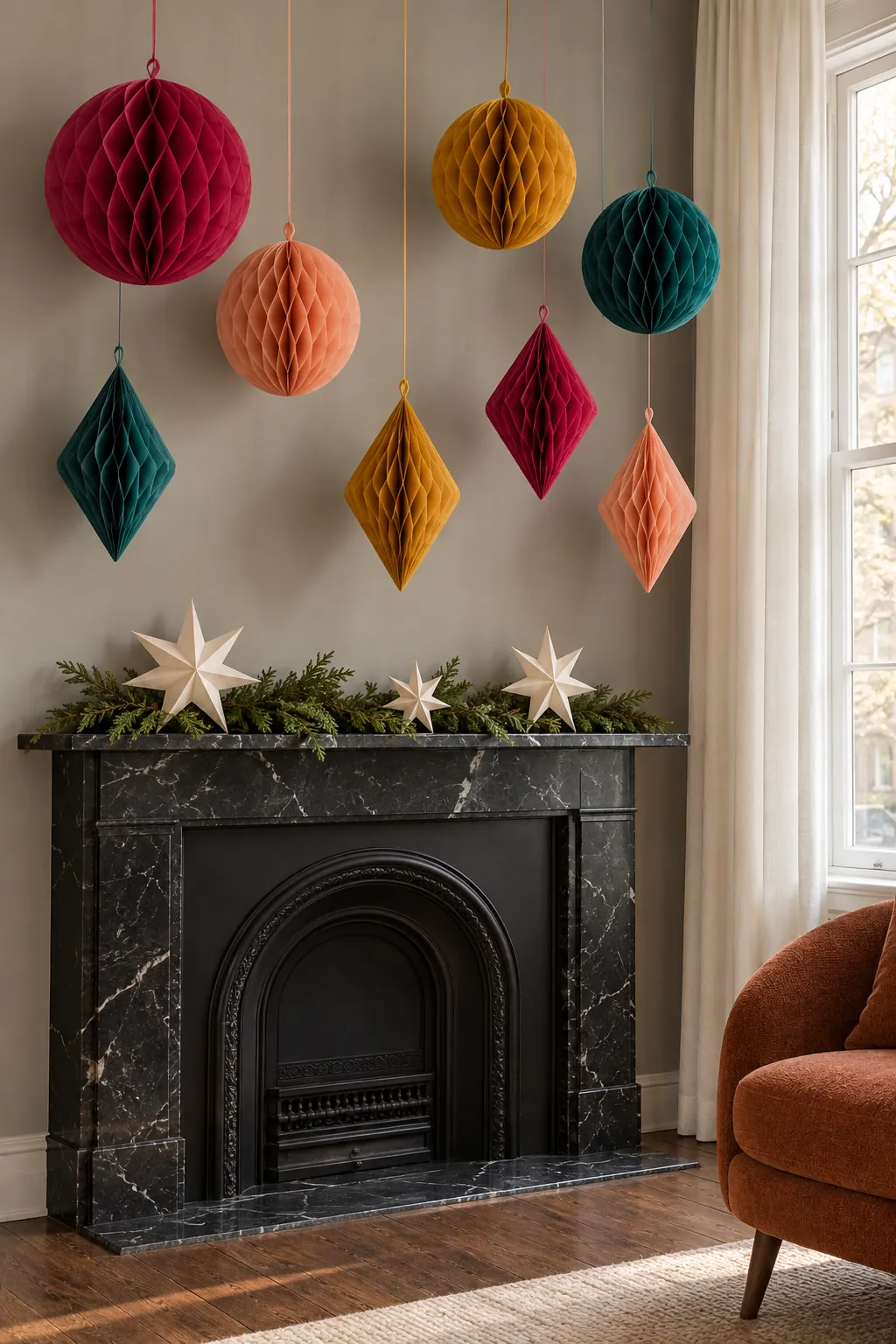Bright paper honeycomb ornaments decorating a narrow Christmas mantel