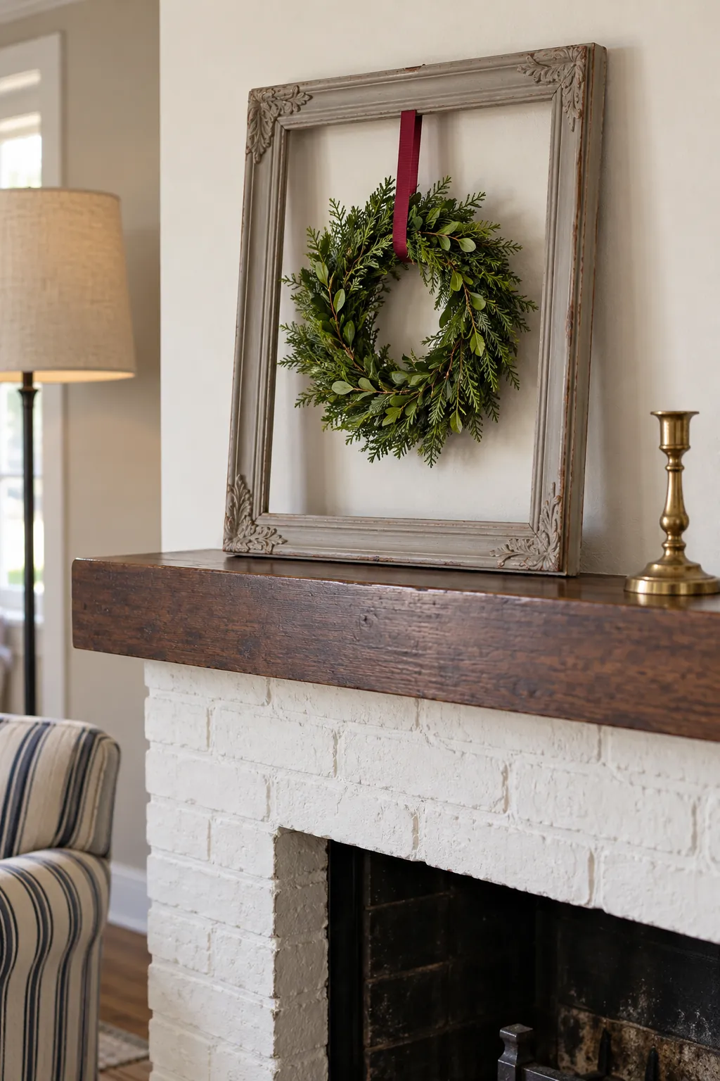 Small evergreen wreath suspended inside a thrifted frame