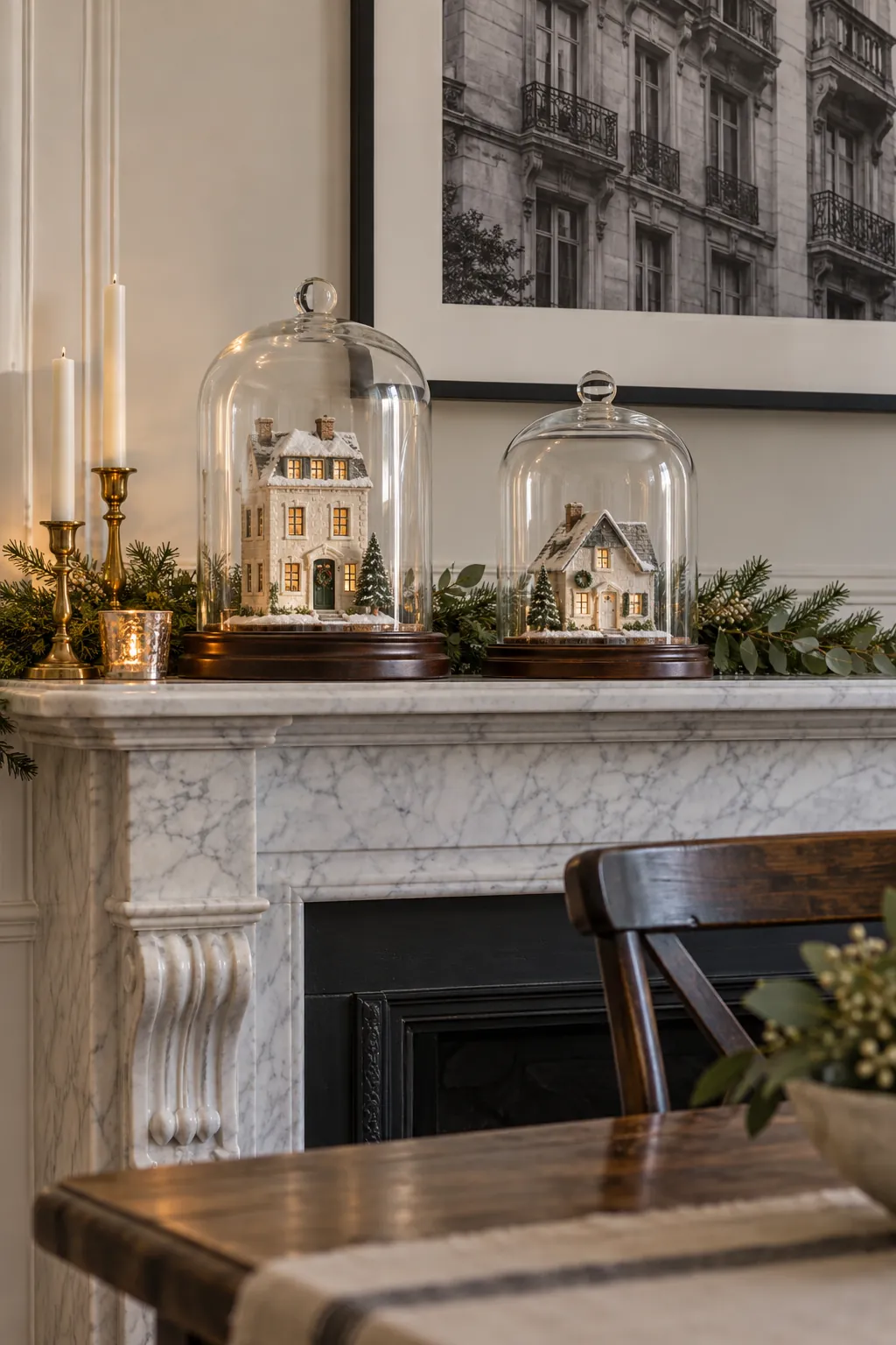 Delicate Christmas village houses protected by glass cloches