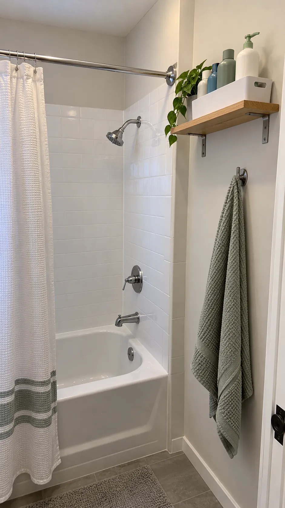 A High Shelf Outside the Splash Zone used for storage in a small tub shower with no niche