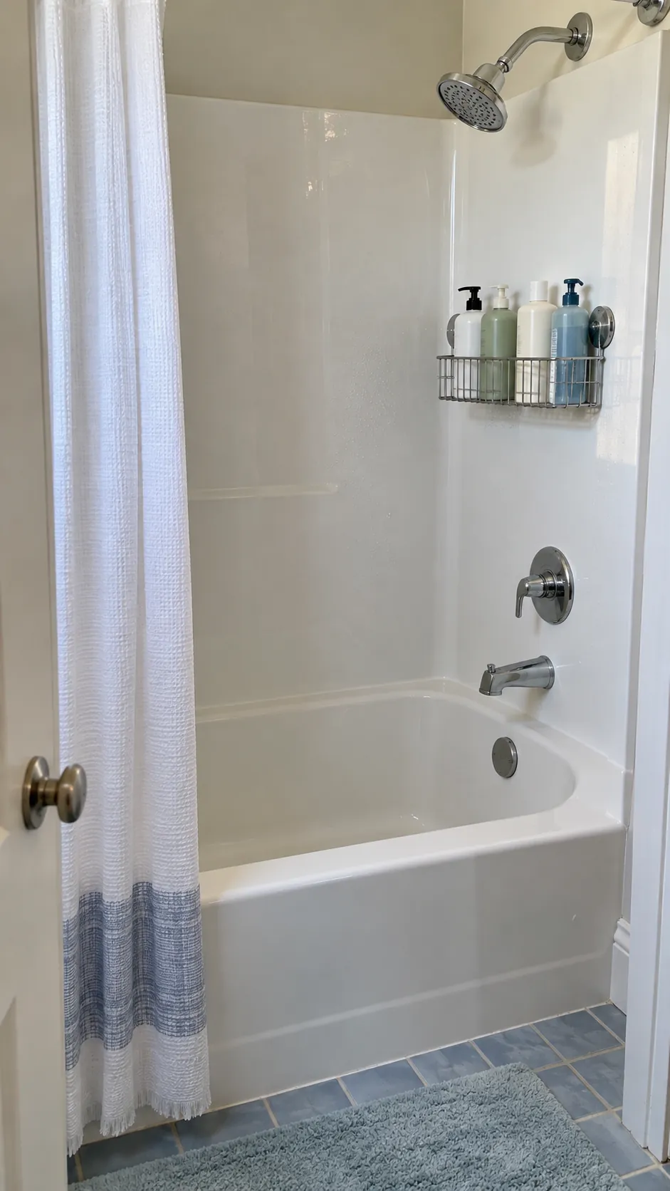 A Daily Bottle Limit With Backup Storage used for storage in a small tub shower with no niche