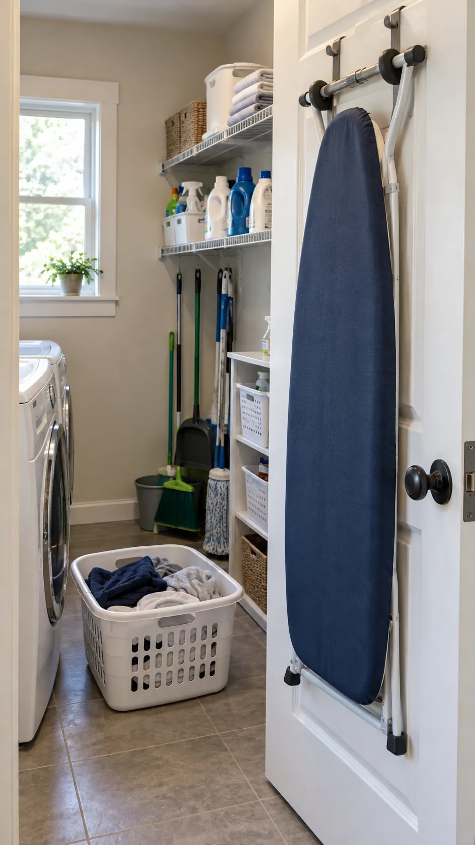 Hang the Ironing Board Behind the Door for organized storage in a small laundry room